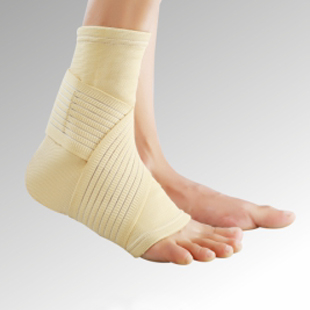 A person wearing a beige Ankle binder