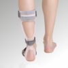 A person with bare feet is wearing a white plastic ankle-foot orthosis (AFO)