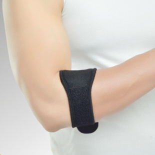 A person wearing a black elbow brace