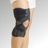 A person wearing a black OA Knee Brace