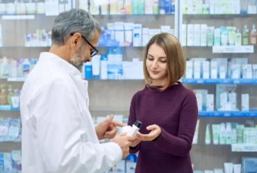 women buying medicine from pharmaceutical