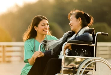 Women in wheelchair talking to nurse