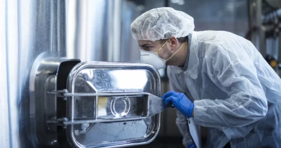 doctor-looking-into-autoclave-machine